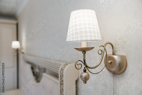 Beautiful classic sconces with a lampshade for a classic retro interior. © andrey