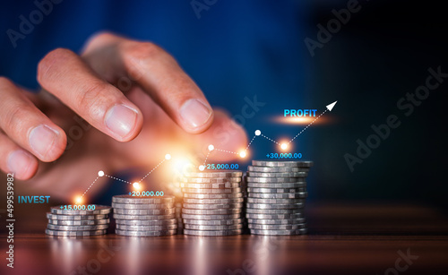 Hand counting coins stack for background business investment investor and stock market concept