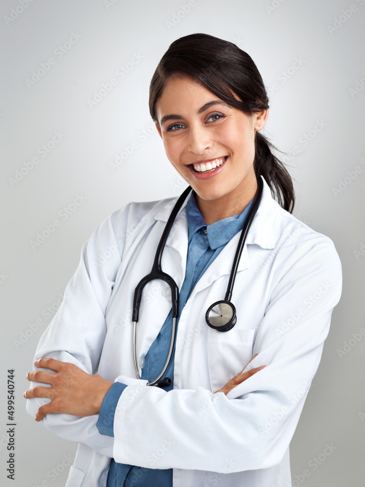 I want to see you well again. Studio portrait of a confident young doctor posing against a grey background. I want to see you well again. Studio portrait of a confident young doctor posing against a grey background.