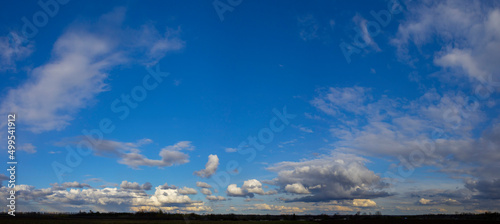 Fototapeta Naklejka Na Ścianę i Meble -  Panorama of blue sky with white fluffy clouds