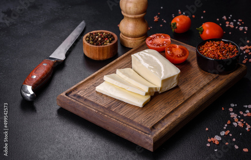 Image of a bar and grated mozzarella cheese on a dark background