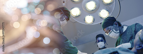 Fotografiet Medical surgical doctor team performing surgery patient, Group surgeon at work o