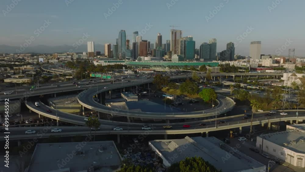 flying over freeways towards downtown LA skyline flying over freeways towards downtown LA skyline