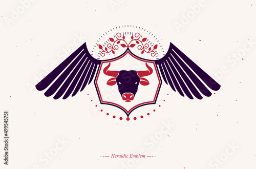 Vector retro insignia design decorated with eagle wings and made using vintage elements like pentagonal stars and bull head illustration