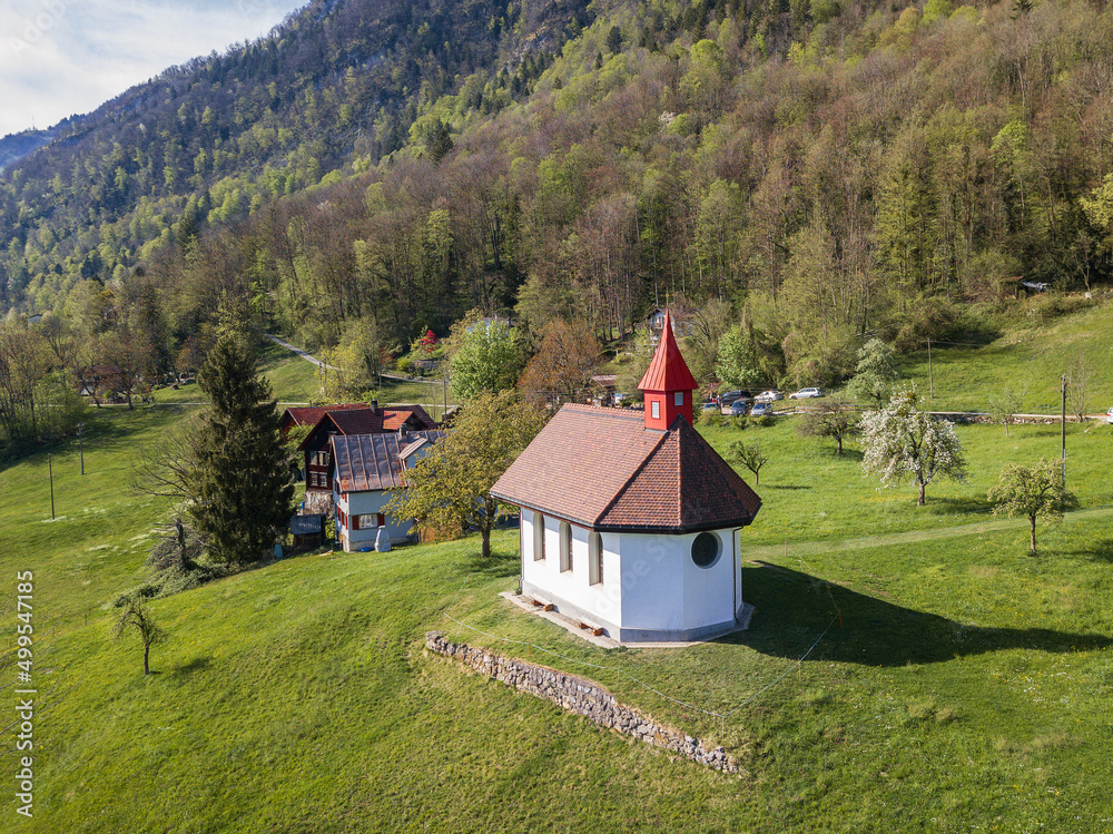 Aerial image of the little chapel at Betlis hill side over the Walensee Lake in Switzerland