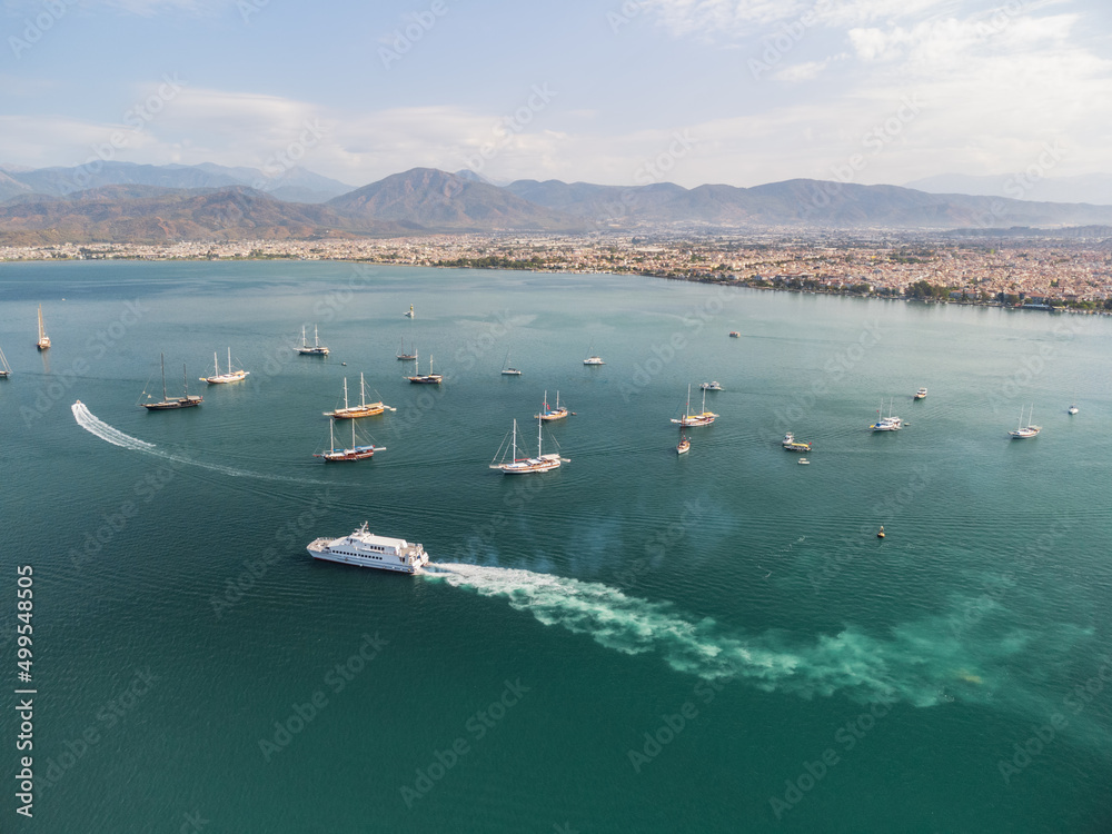 Aerial view of white ship crossing Fethiye Bay, Turkey