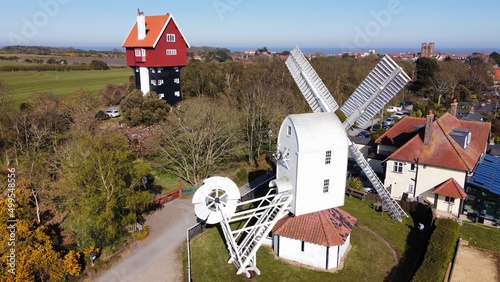 Aerial view Windmill and House in the clouds thorpeness Suffolk England 