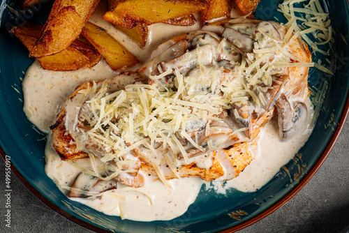 Quadro em tela Grilled chicken steak with potato wedges and creamy sauce