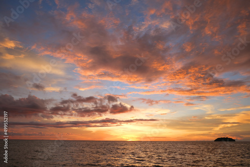 Fototapeta Naklejka Na Ścianę i Meble -  Beautiful sunset at Tanjung Aru, Sabah. Tanjung Aru is a sub-district of Kota Kinabalu in Sabah, of Malaysia. The beach stretches over 2 kilometres long along with new skyscrapers.