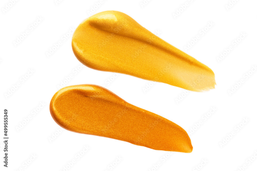 Abstract golden and bronze glitter beauty smear isolated on white background. Cosmetic or paint product. Abstract golden and bronze glitter beauty smear isolated on white background. Cosmetic or paint product.
