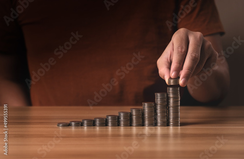 businessman stacking coins. save money and investment growth concept. Savings and pensions, collecting money, financial planning, save money for the future