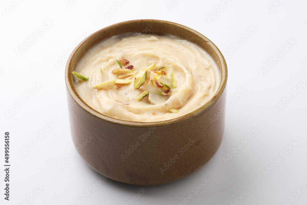 Stockfoto Shrikhand is an Indian sweet dish made of strained curd