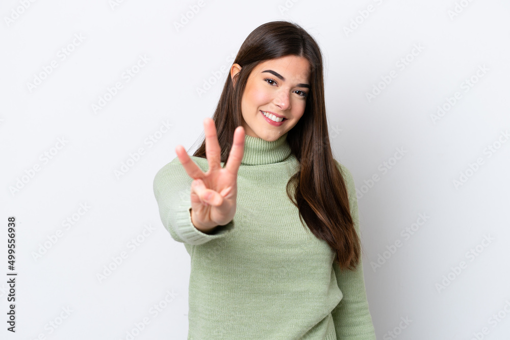 Young Brazilian woman isolated on white background happy and counting three with fingers Young Brazilian woman isolated on white background happy and counting three with fingers