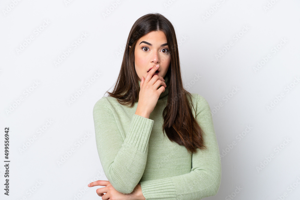 Young Brazilian woman isolated on white background surprised and shocked while looking right Young Brazilian woman isolated on white background surprised and shocked while looking right