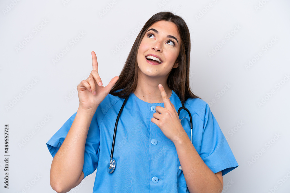 Young Brazilian nurse woman isolated on white background pointing with the index finger a great idea Young Brazilian nurse woman isolated on white background pointing with the index finger a great idea
