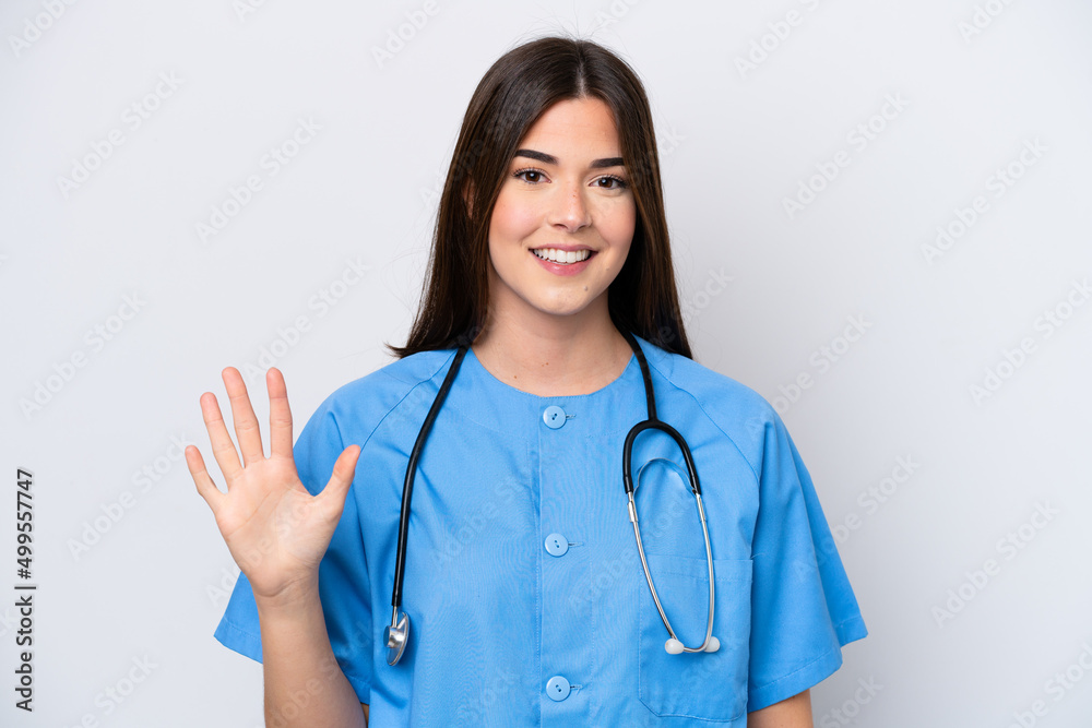 Young Brazilian nurse woman isolated on white background counting five with fingers Young Brazilian nurse woman isolated on white background counting five with fingers