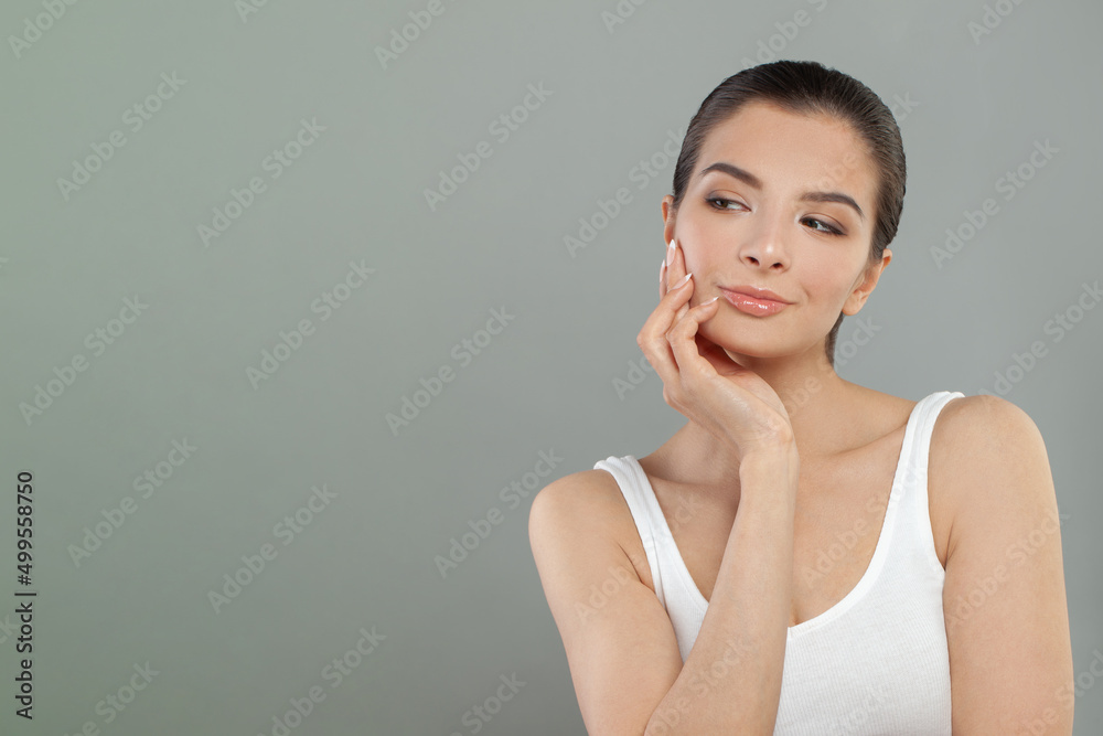 Studio shot of cute woman looking sideways with thoughtful and sly expression, raising one brow as if having good idea, planning something Studio shot of cute woman looking sideways with thoughtful and sly expression, raising one brow as if having good idea, planning something