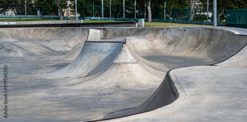 Public playground for a skateboard in a recreation park. photo