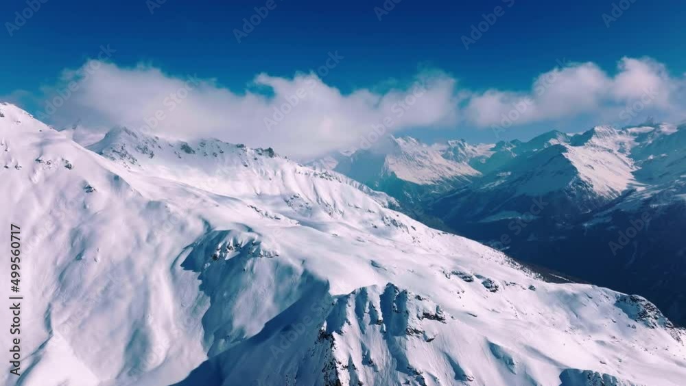 Snow-covered Becca de Lovegno Mountain In The Pennine Alps in Switzerland. - aerial Snow-covered Becca de Lovegno Mountain In The Pennine Alps in Switzerland. - aerial