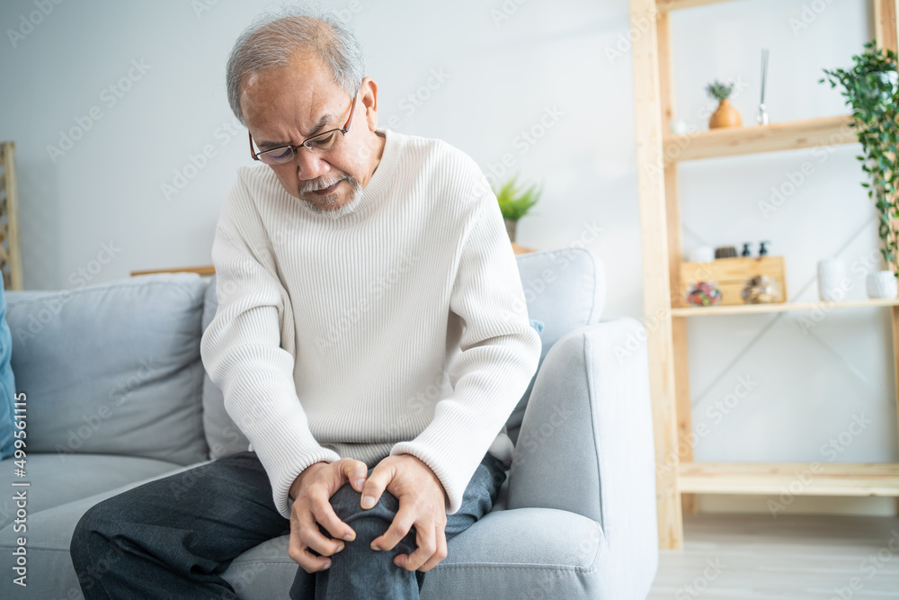 Asian senior elderly man feel painful and suffering from injured leg. Asian senior elderly man feel painful and suffering from injured leg.