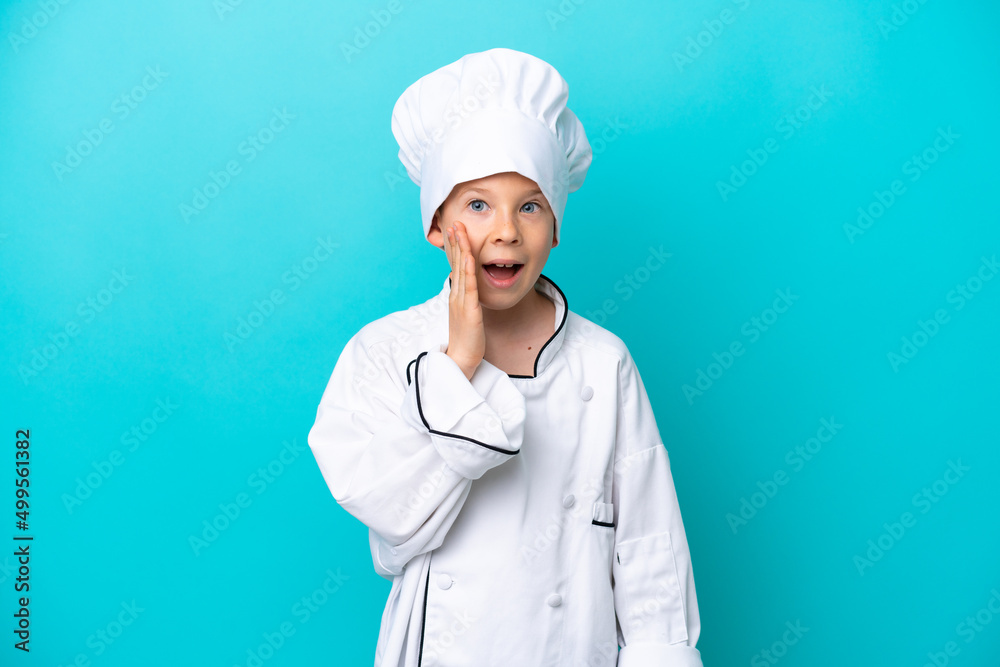 Little chef boy isolated on blue background with surprise and shocked facial expression Little chef boy isolated on blue background with surprise and shocked facial expression