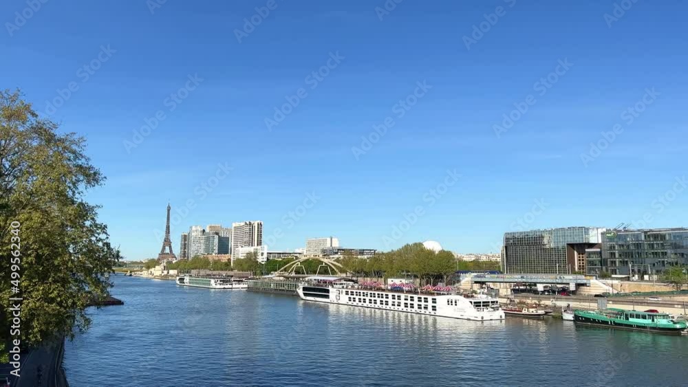 Paris video with view of bridges, Seine river, Pont des Arts and Eiffel tower. Historic Parisian city center from above during warm summer. Famous holidays vacation destination. Paris video with view of bridges, Seine river, Pont des Arts and Eiffel tower. Historic Parisian city center from above during warm summer. Famous holidays vacation destination.