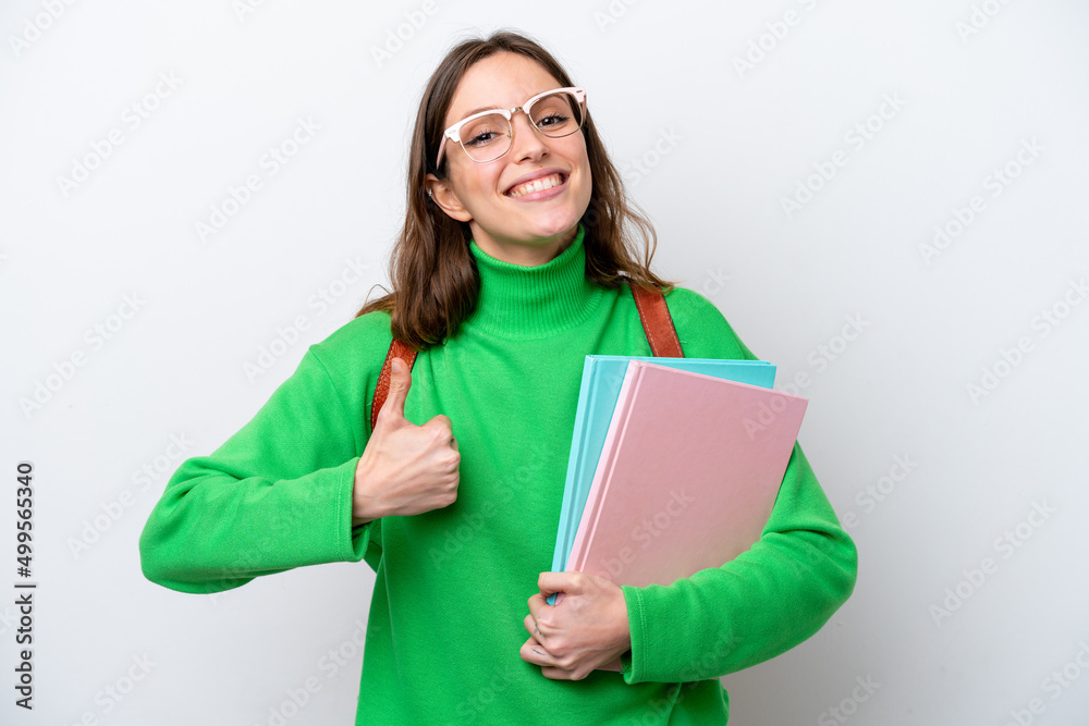 Young student caucasian woman isolated on white background with thumbs up because something good has happened Young student caucasian woman isolated on white background with thumbs up because something good has happened