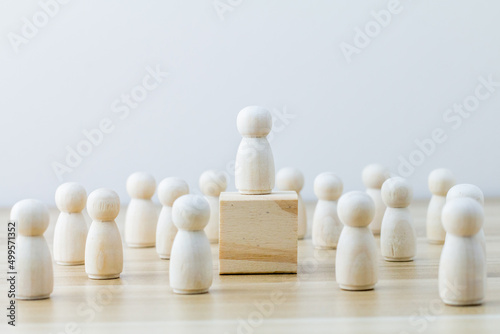 Human resource, Talent management, Recruitment employee, Successful business team leader concept. Hand chooses wooden people standing out from the crowd.