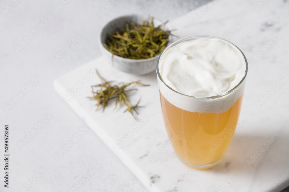 Chinese Cheese Tea with layer of creamy foam. Asian trendy beverage. Thai milk tea. Close up. Copy space. Chinese Cheese Tea with layer of creamy foam. Asian trendy beverage. Thai milk tea. Close up. Copy space.