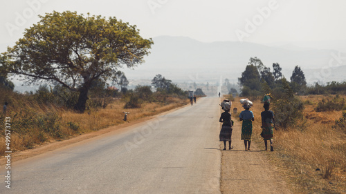 Road National 7 in the south of Madagascar, african landscape with women walking while carrying food on their head. Desertic and arid landscape