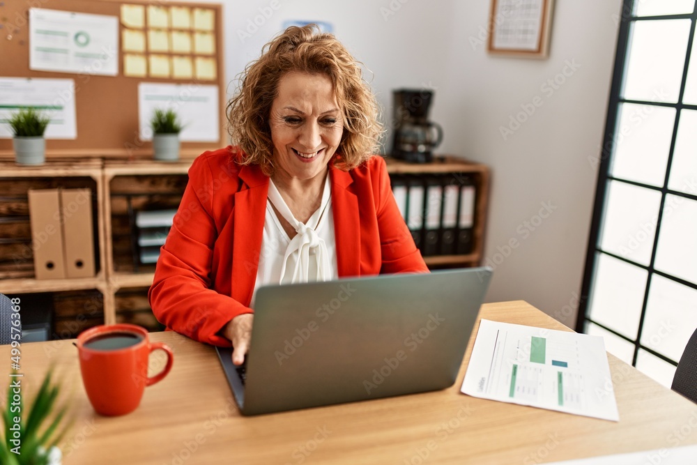 Middle age caucasian businesswoman smiling happy working at the office. Middle age caucasian businesswoman smiling happy working at the office.