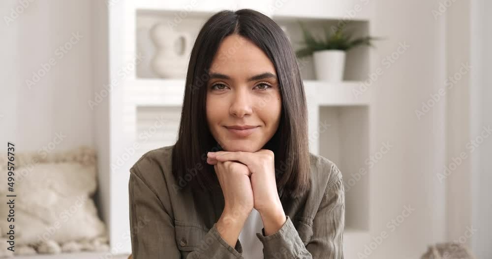 Happy woman smiling looking at camera at home office. Business woman coach mentor closeup portrait. Businesswoman enjoys life. Professional entrepreneur female student 4K Happy woman smiling looking at camera at home office. Business woman coach mentor closeup portrait. Businesswoman enjoys life. Professional entrepreneur female student 4K