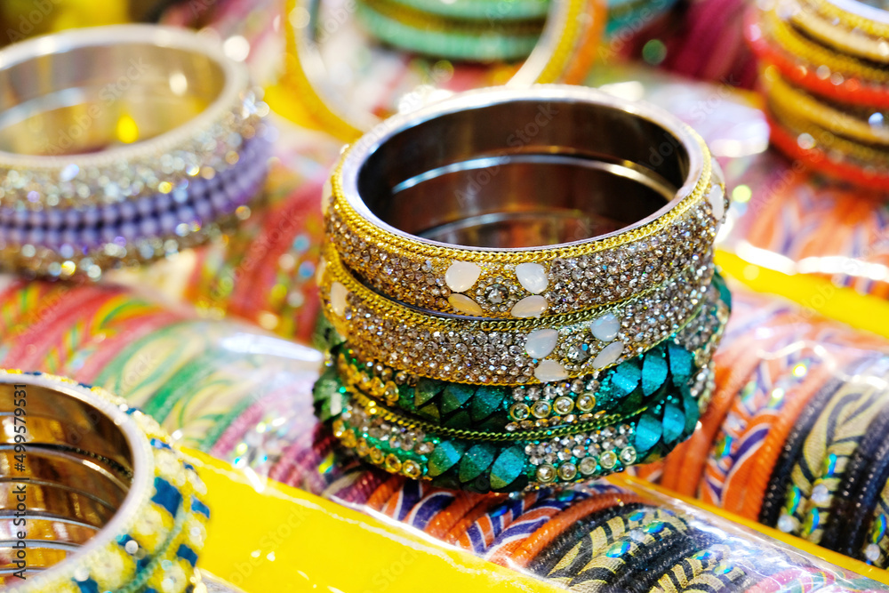 17 April 2022, Pune , India, Colorful Bangles display in Shop for women, Metal Bangles Arranged On The Shelf For Sell, Series of bangles.