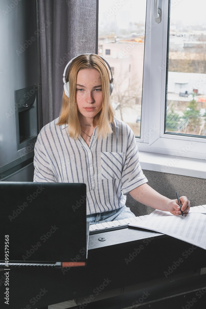 Music.girl plays piano. Music background, creates music, a soundtrack. Business hobbies, relaxation and psychology. Education and remote work music making. AI-Generated Music Music.girl plays piano. Music background, creates music, a soundtrack. Business hobbies, relaxation and psychology. Education and remote work music making. AI-Generated Music