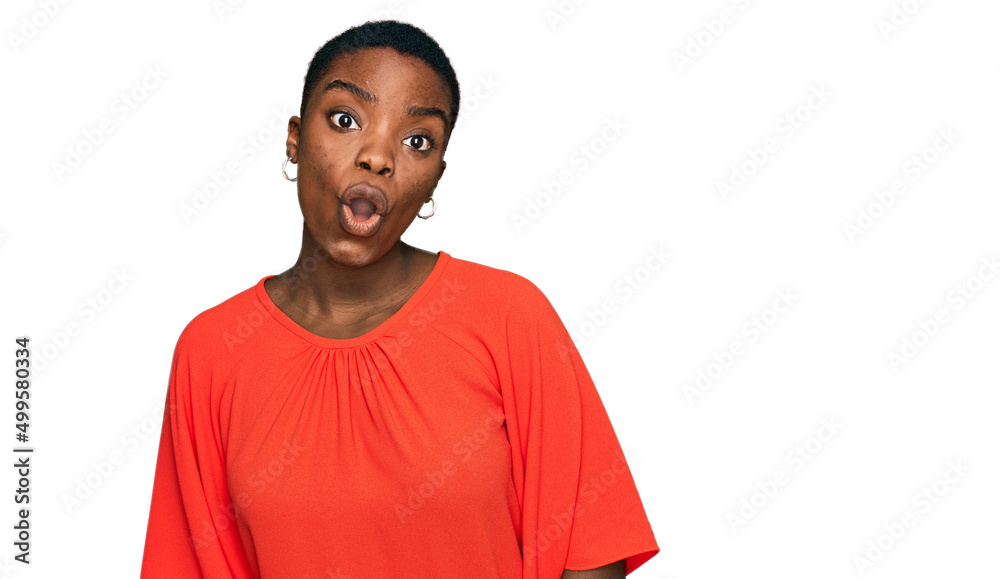 Young african american woman wearing casual clothes afraid and shocked with surprise expression, fear and excited face. Young african american woman wearing casual clothes afraid and shocked with surprise expression, fear and excited face.