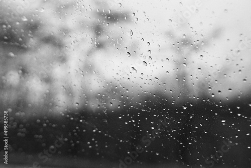 Raindrops on window glass with blur background © RA_fotografia