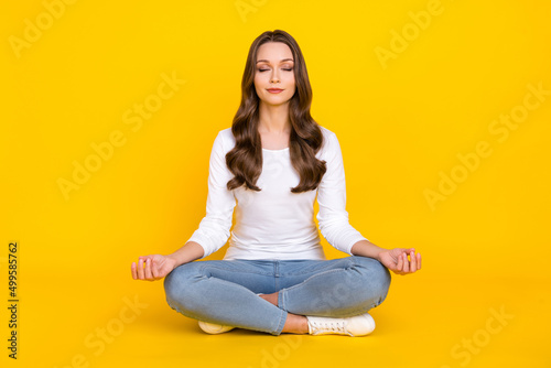 Canvastavla Photo of sweet peaceful woman wear white shirt practicing yoga sitting legs cros
