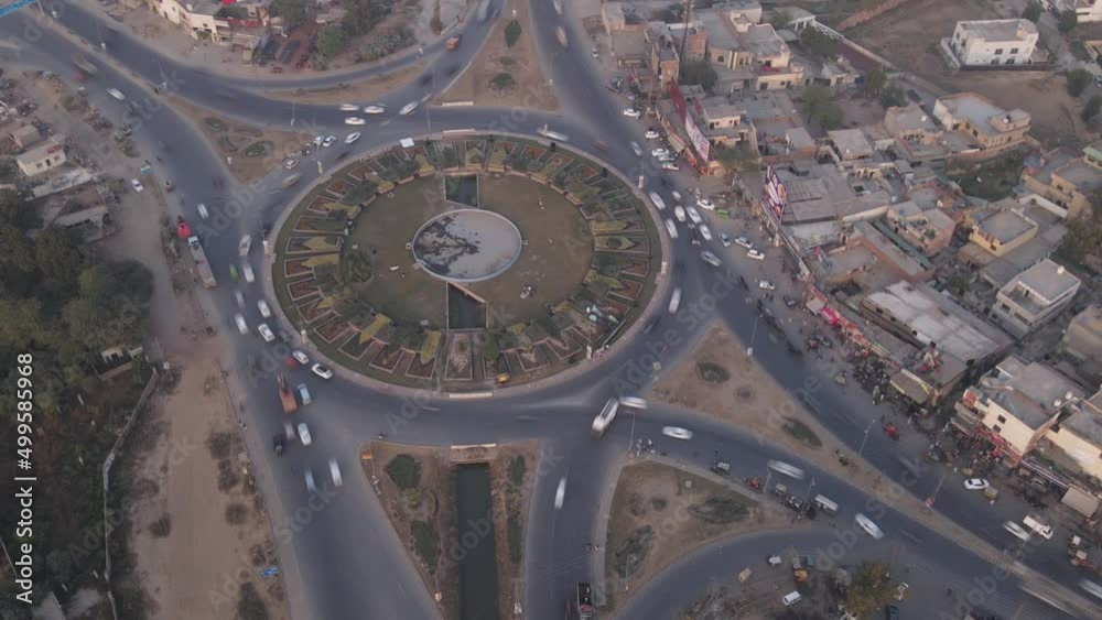 Aerial time-lapse or hyper-lapse of moving cars at traffic circle Aerial time-lapse or hyper-lapse of moving cars at traffic circle