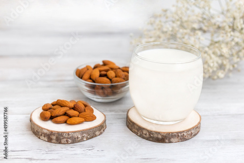 Vegan Nut Milk. Almond Milk in glass and almond nuts. Copy space . Top view 