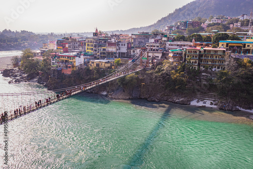 lakshman jhula iron suspension bridge over ganges river from flat angle photo