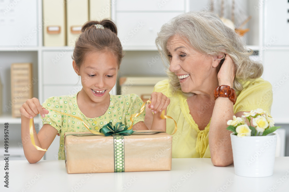Portrait of senior woman giving a present Portrait of senior woman giving a present