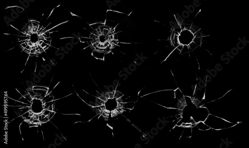 holes from balls in glass on a black background, collection.