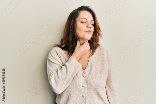 Young caucasian woman wearing casual clothes touching painful neck, sore throat for flu, clod and infection