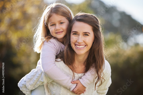 Nothing beats a little quality time. Cropped portrait of an attractive young woman and her daughter posing outside in the garden at home.