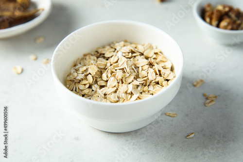 Healthy rolled oats in a white bowl © marysckin