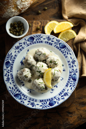 Traditional homemade meatballs with cream, capers and lemon