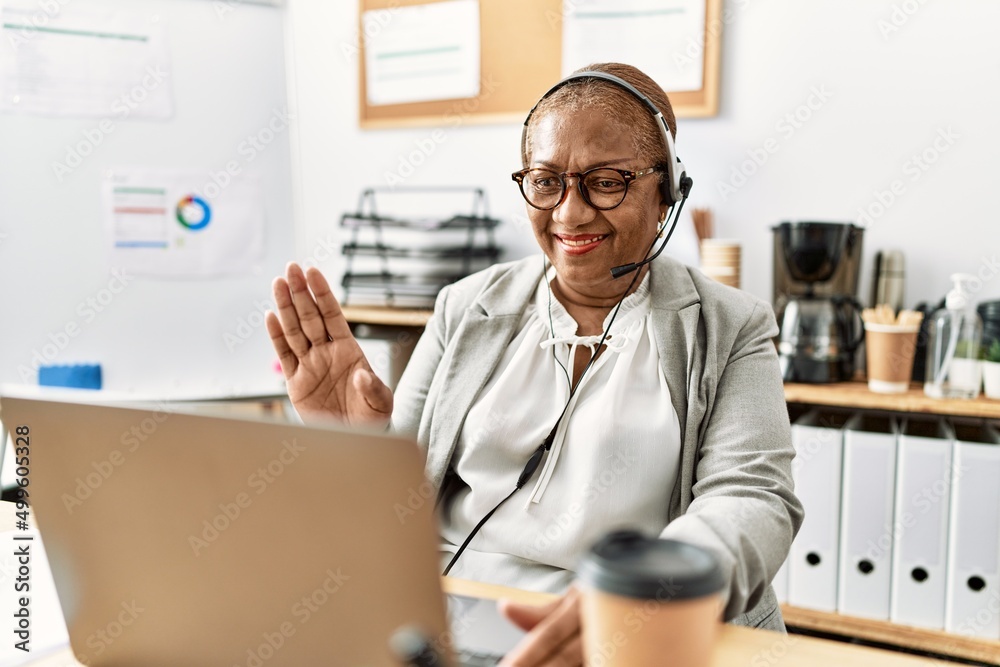 Senior african american woman call center agent having video call at office Senior african american woman call center agent having video call at office