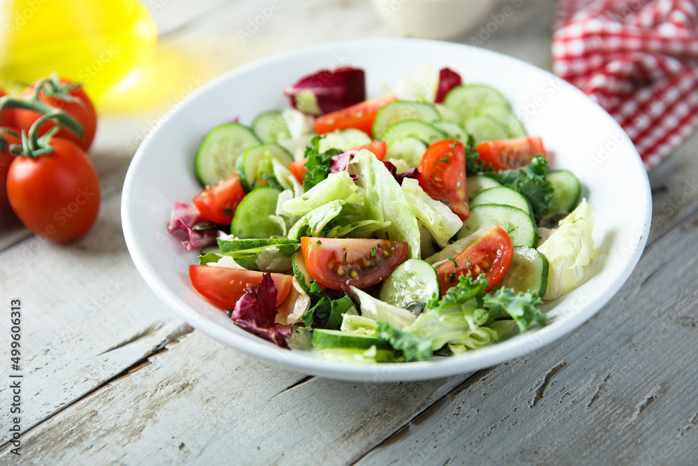 Healthy green salad with tomato and cucumber Healthy green salad with tomato and cucumber