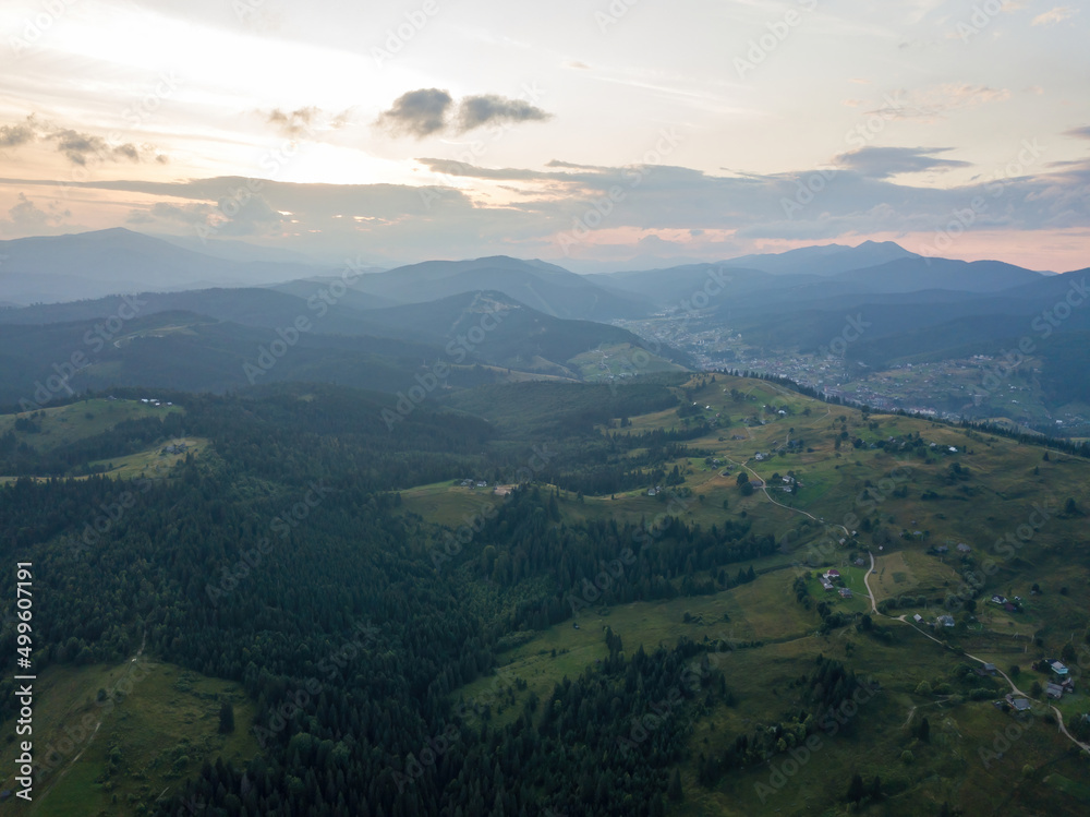Fototapeta premium Sunset over the mountains in the Ukrainian Carpathians. Evening. Aerial drone view.