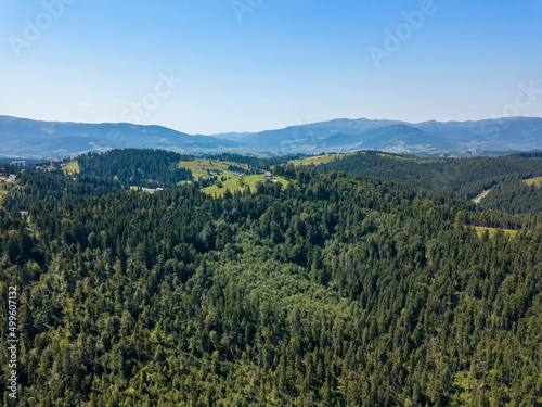 Green mountains of Ukrainian Carpathians in summer. Sunny clear day. Aerial drone view. © Sergey